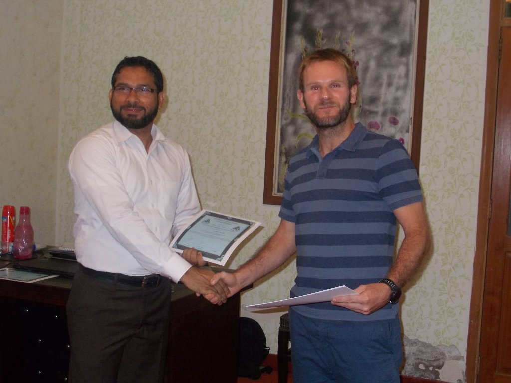 BEC engineer handing completed work documents to a client