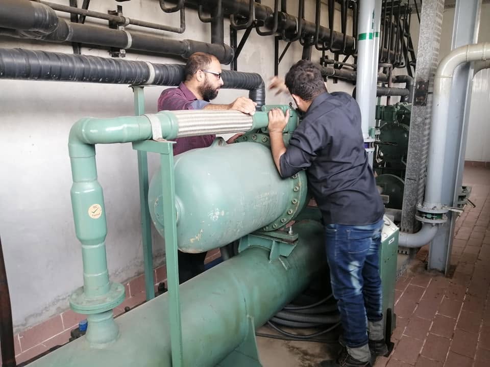 BEC engineers servicing a large industrial chiller unit
